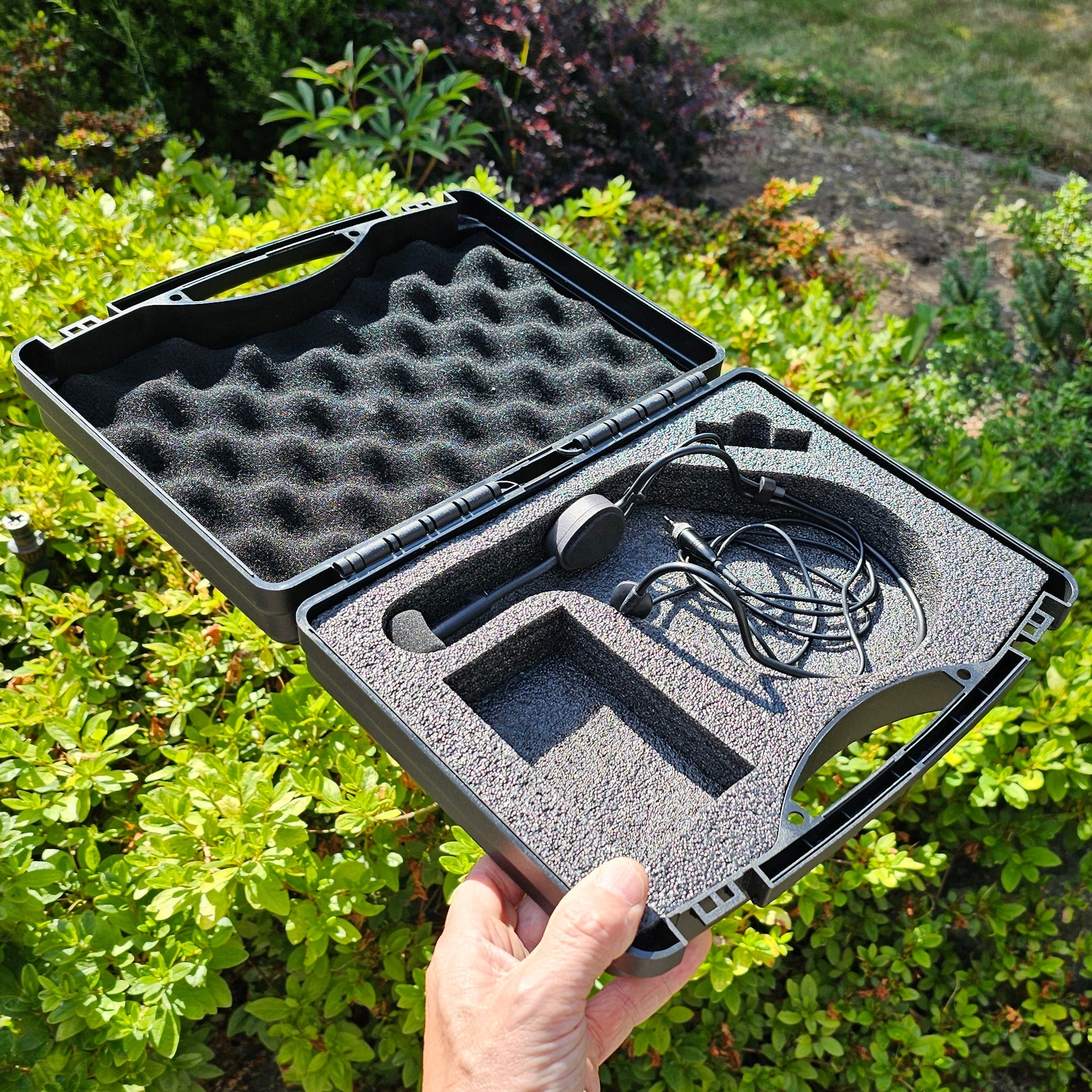 Black electronic device in a foam case 